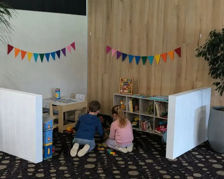 Two children playing with toys in the indoor kids play area at Cardiff Bowlo